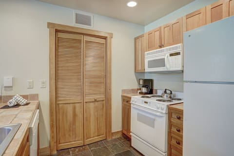 Fully equipped with stainless-steel appliances and plenty of counter space, the kitchen invites home-style dining in the Rockies.