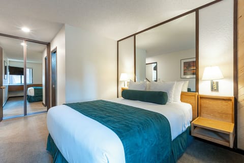 Unwind in crisp linens with mirrors that widen space.
