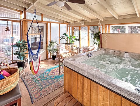 Private hot tub in a warm and cozy sunroom.