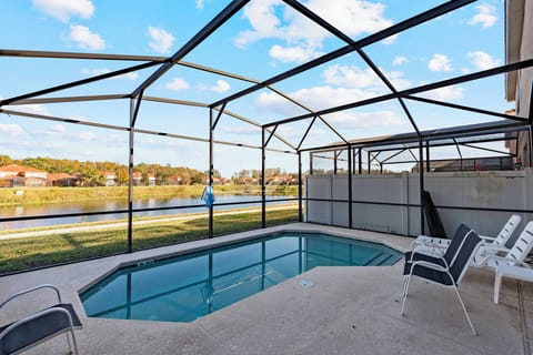 Step outside to your private pool area with lounge chairs, perfect for relaxing under the sun. The tranquil water reflects the landscape, creating an ideal spot for sun-soaked afternoons or peaceful evening strolls by the water.