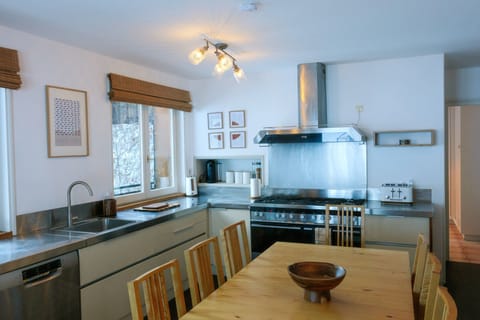Upper chalet kitchen with large range oven, built in microwave, dishwasher etc