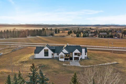 Exterior of Equinox, featuring 2.4 acres of green space only 3 minutes from Spruce Meadows.