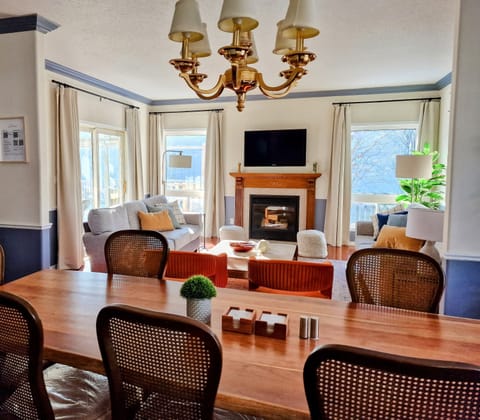 Large living room with two 3-seater sofas and a large dinner table seater 10