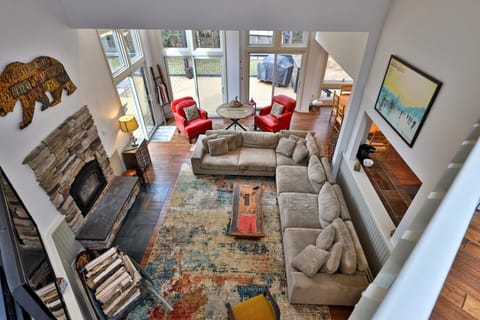 Aerial view showing the massive sectional and open layout. Keep an eye on the fire while checking in from the loft.