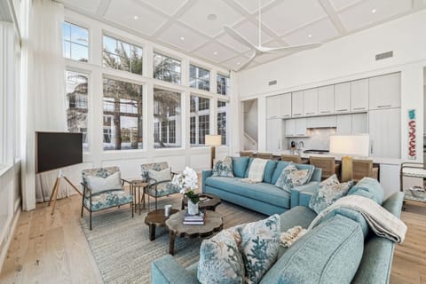 Gather under soaring ceilings with panoramic windows and plush seating.