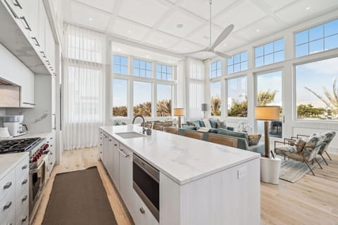 Cook and connect around a sleek island in bright elegance.