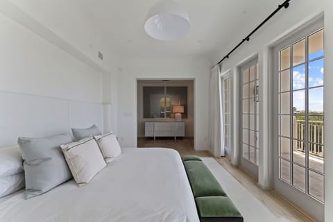 Wake to soft linens and sunshine pouring through French doors