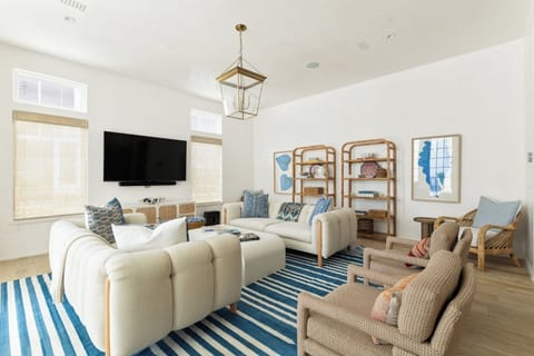 Stretch out on plush sofas beneath bright, beachy decor.
