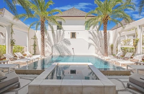 Soak up sunshine on loungers beside the sparkling pool.