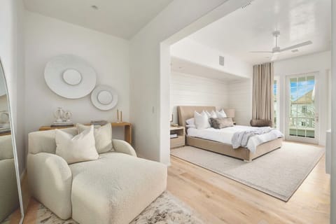 Unwind in a bright suite with plush seating and balcony doors