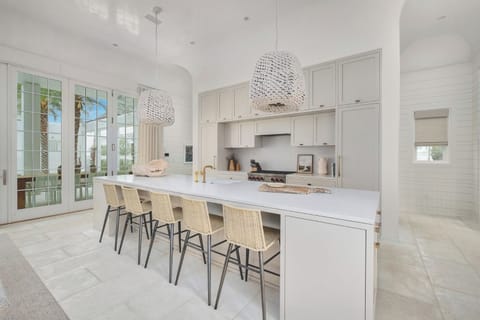 Cook and mingle around the oversized island with stylish seating.