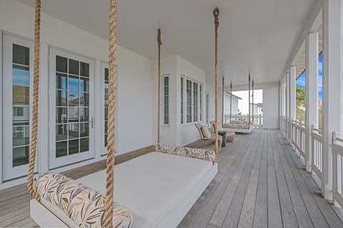 Sway gently on the daybed and savor coastal breezes.