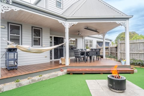 Large undercover deck area with heaters, hammocks and fire pit