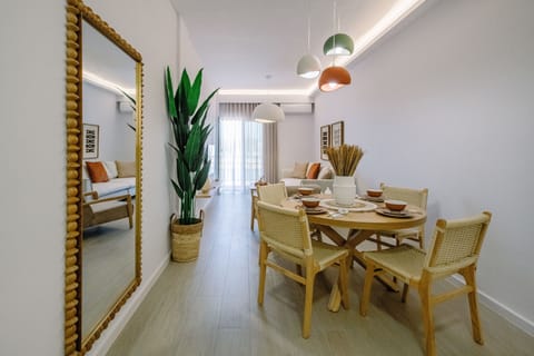 Bright dining area blending natural textures with modern lighting