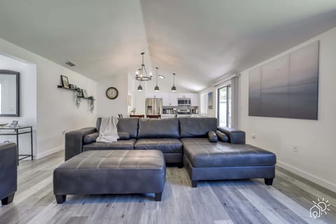Living Room: Spacious lounge with sleek leather furniture and soft lighting—perfect for relaxation!