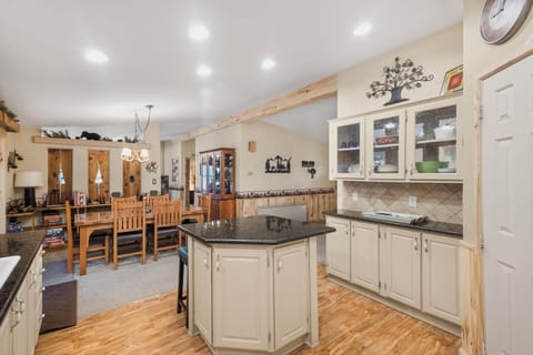 Open fully equipped kitchen which flows into the dining area.