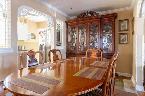 Elegant formal dining room with large table – perfect for family meals or group gatherings