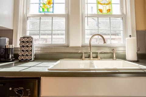 kitchen equipped with gas range, microwave, and fully stocked cabinetry