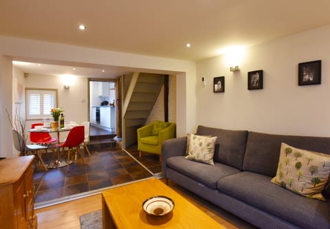 Inviting lounge with TV and plush seating area  - ideal for relaxing after a long day exploring Canterbury.