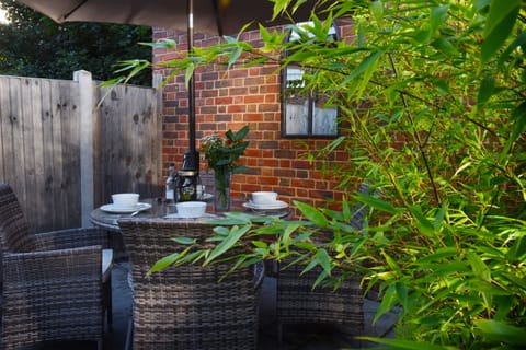 Private garden with outdoor dining, ideal for al fresco meals and summer evenings.