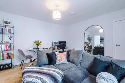 The spacious living room is perfectly equipped for a leisure or business stay - featuring a large comfy sofa, SMART TV, dining table to seat 2 and a productive desk space with monitor so you can plug in and even work from home!
