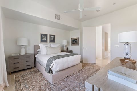 Drift off in crisp linens with calming, coastal-inspired decor.