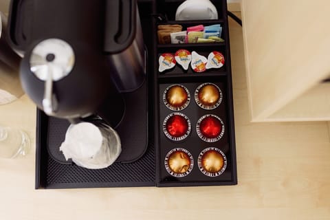 Kickstart your day with a delightful coffee experience right in the comfort of your room at Hotel Eleo.