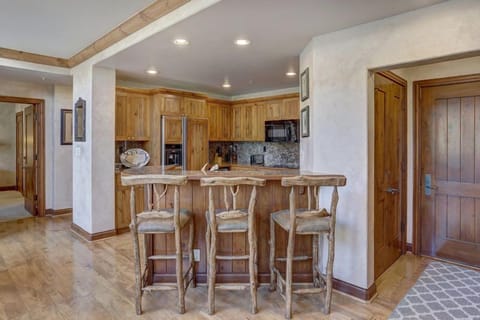 Open kitchen and breakfast bar designed for easy entertaining and relaxed family meals.