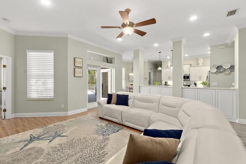 Open living room with smart TV and direct lanai access