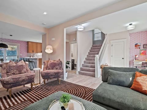 - Cozy living room with stylish seating and décor - Open floor plan connects seamlessly to kitchen - Perfect Airbnb home for family and friends