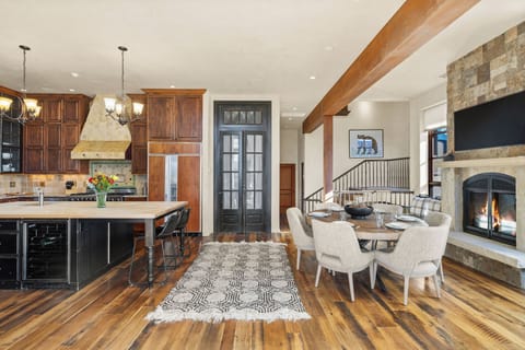 Spacious kitchen/dining room with gas fireplace, TV, and room to cook and entertain.