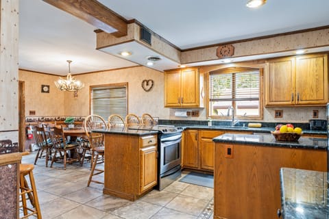 Open kitchen and dining area designed for shared meals and laughter — the heart of every getaway.