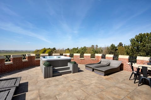 The hot tub and terrace at Priory Lodge, Essex