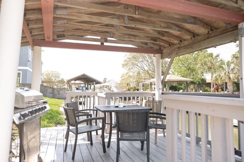 Dockside patio with grill and seating for a meal on the canal watching the sunset!