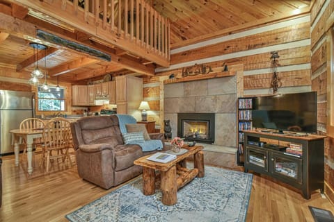 Log cabin interior 
Living room view into kitchen