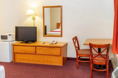 Kick back with TV, mini fridge, and microwave convenience.