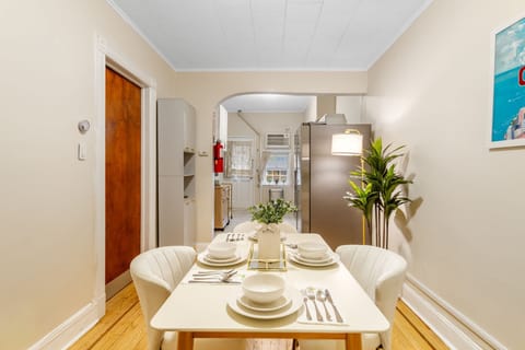Enjoy meals or casual chats in this bright dining area that connects seamlessly to the kitchen. The open layout and neutral tones make it a great spot to gather and plan your day.