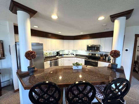 Fully equipped kitchen open to dining area and Living room