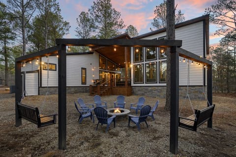 Settle into a swing, feel the fire warm your toes, and watch the sky melt into sunset as the string lights glow above you. Perfect for s’mores, long conversations, and real connection with your group.
