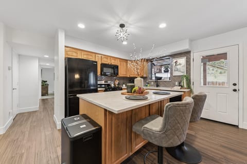 Spacious kitchen with modern appliances and cozy breakfast bar