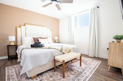 Bright and stylish bedroom with cozy bedding—your perfect retreat awaits. Book your comfort today!
