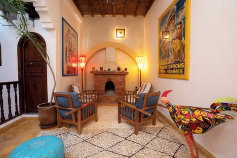 Main sitting area, fireplace and an Amazon Alexa