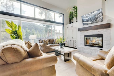 Primary floor living room with fireplace, tv, whole house sound system, and mountain views.