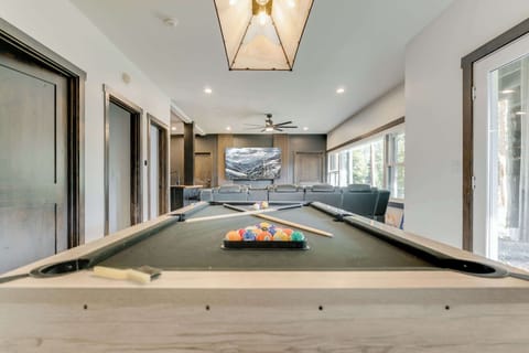 Game Room with 85" tv and theater seating.  Includes full kitchen, popcorn machine, Nintendo Switch, PS5, a DVD library and more!