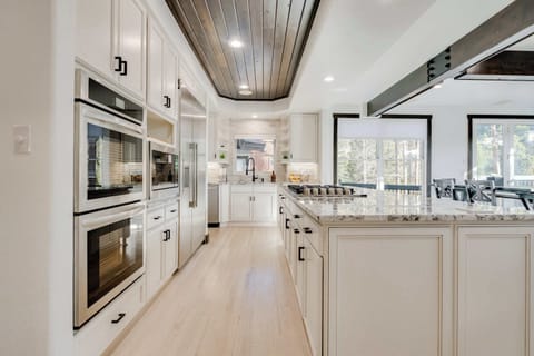 The primary kitchen with double oven, gas range, microwave and coffee bar.  Plus plenty of small appliances for those family meals!