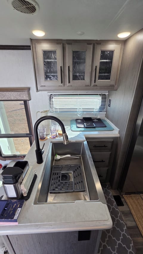 Large farm style sink and premium cabinet space in the kitchen