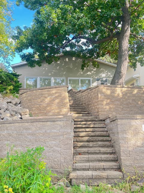 Home overlooks the river. Steps lead to the water