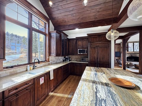 Wash dishes with a view like this and it almost doesn`t feel like a chore. Coffee maker ready to go, microwave for the kids` snacks, dishwasher big enough for real meals. Thoughtfully equipped.