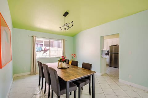 Spacious dining area with seating for six, great for family meals and gatherings.