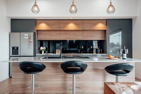 Open-plan modern kitchen, fully equipped for preparing delicious meals and entertaining guests.